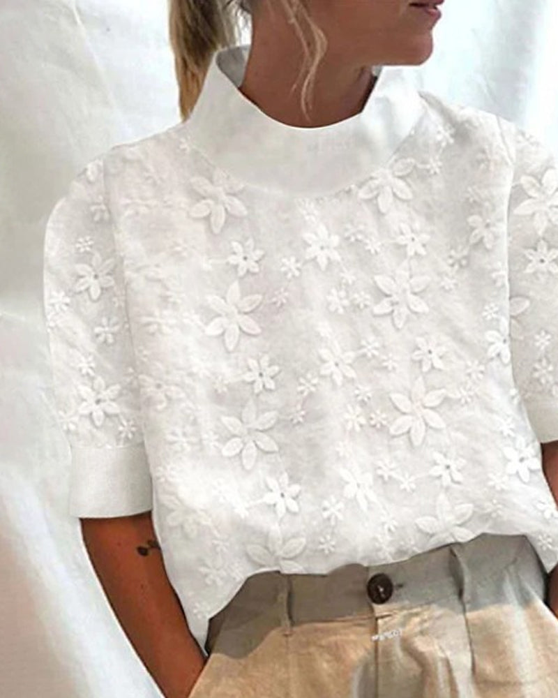 Blouse avec col montant uni brodé