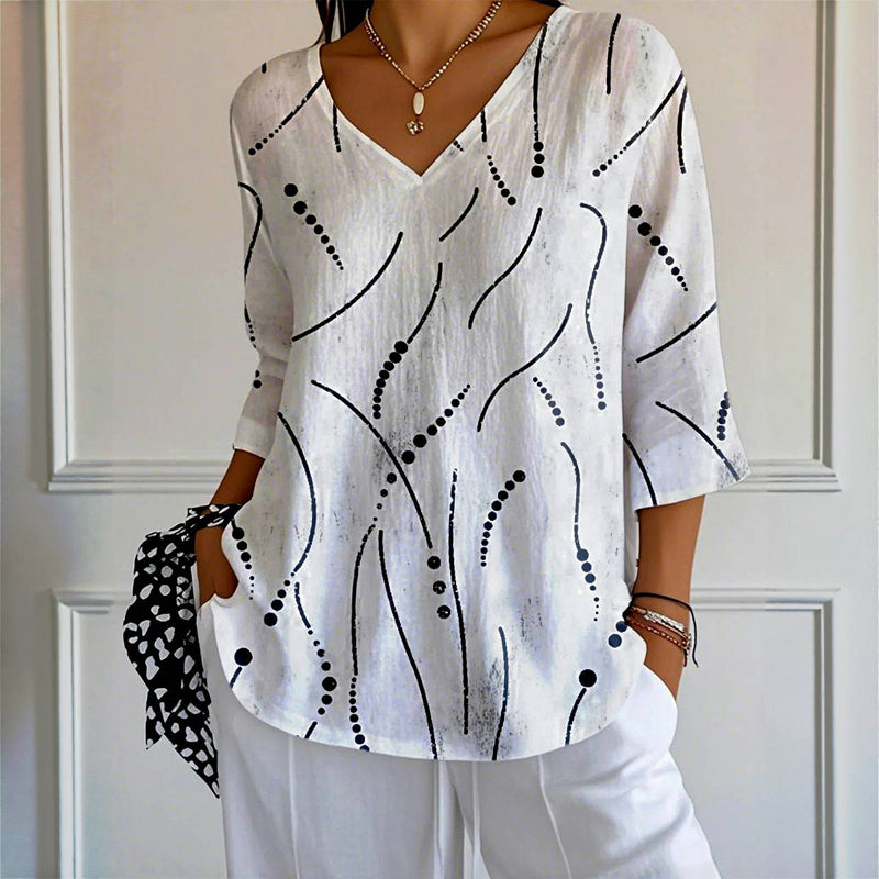 Esmee – Blouse avec un jeu de lignes ludique et une coupe aérienne